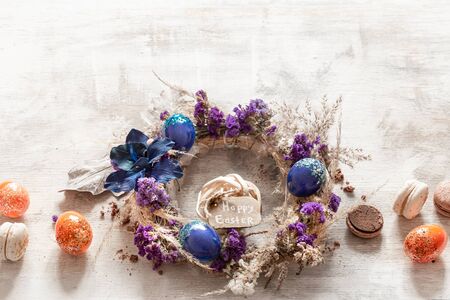 Stylish composition with an Easter wreath and eggs trend blue. The concept of Easter decorations and celebration.の写真素材