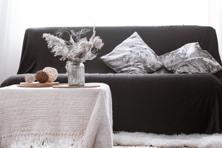 Still life details of nordic living room with a black sofa and decor in the living room.