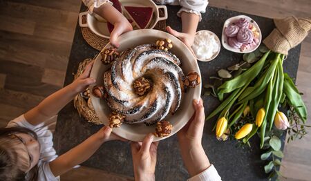 Breakfast or brunch table setting full of healthy ingredients for a delicious Easter meal with friends and family around the table. The concept of the Easter holiday and family values.の写真素材