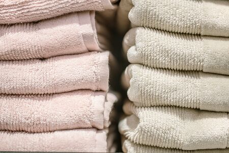 Counter in the store with a stack of towels. Close-up, Bath accessories concept .の写真素材