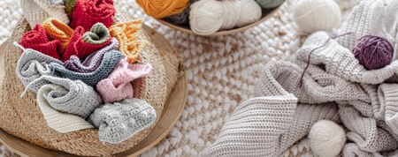 Multicolored balls of thread for knitting in the basket. Concept of Hobbies and crafts .の写真素材
