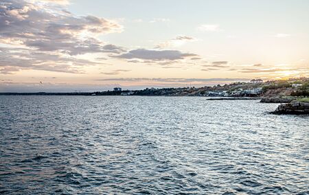 Beautiful sea at sunset near the rocky shore . Nature compositionの写真素材