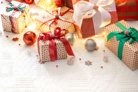 Festive cozy atmosphere on a light background with gift boxes. Christmas gift background . The concept of the celebration.の写真素材