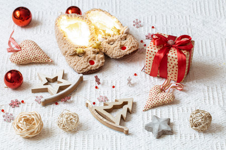Festive New year decor on a light background. Background with cozy items of Christmas decor. The...