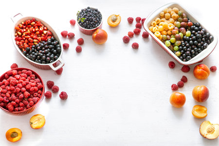 Summer vitamin food concept, various fruit and berries. creative flat lay on light background top...