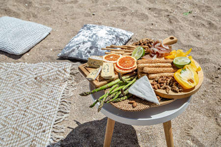 Summer beautiful romantic picnic by the sea. The concept of a holidayの写真素材