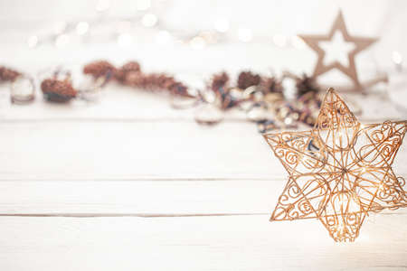 Festive new year background with a star and lights. Concept of holidays and gifts.の写真素材