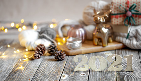 New year's holiday composition with wooden numbers 2021 and festive decor. The concept of...