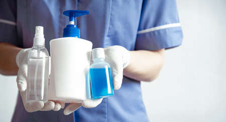 The doctor holds in hands personal protective equipment against the spread of the Corona virus.の写真素材