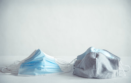 Different types of face masks protection for coronavirus prevention: reusable homemade cloth wear,...