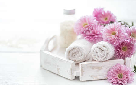 Spa still life with body care products and flowers. Hygiene, cleanliness and body care concept.の写真素材