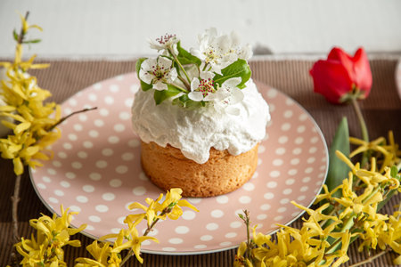 Spring composition with Easter cake on a beautiful plate close up.