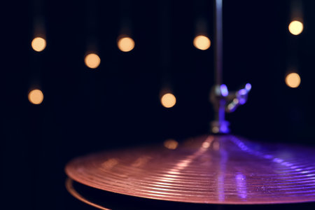 Part of a drum kit in the dark with beautiful lighting. Concert and performance concept.の写真素材