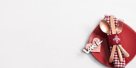 Composition with a plate and cutlery for a romantic dinner for Valentine's Day top view. Dating concept.の写真素材