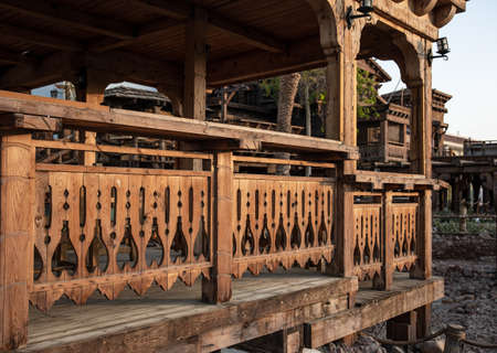Wooden carved railing of a large old wooden house.の写真素材