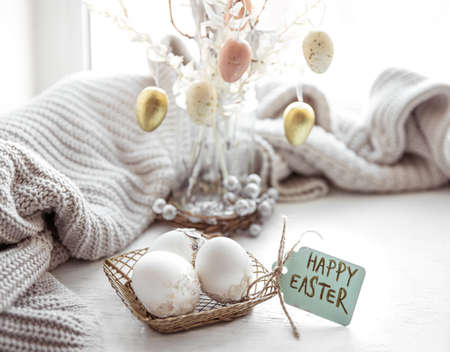 Easter still life with Easter eggs and details of the festive decor.の写真素材