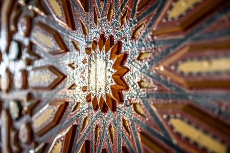 Close up of colored ornament on wood in traditional oriental style.