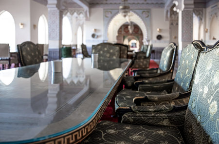 Hall design with a large glass table and chairs in Egyptian style.