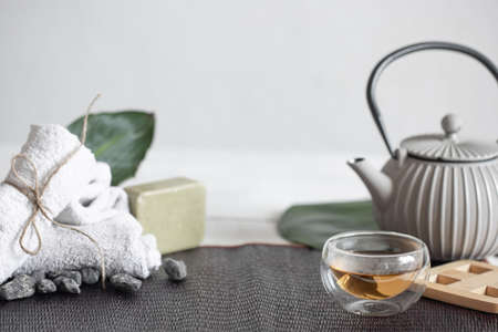 Spa still life with face and body skin care products and tea.の写真素材