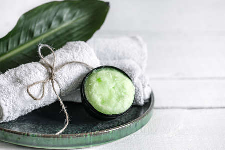 Spa still life with organic skincare, natural leaf and towels copy space. The concept of beauty and organic cosmetics.の写真素材