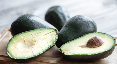 Close up cutaway avocado with bone. Healthy and wholesome food concept.