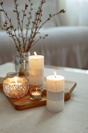 Close up of burning candles as a detail of home decor.の写真素材