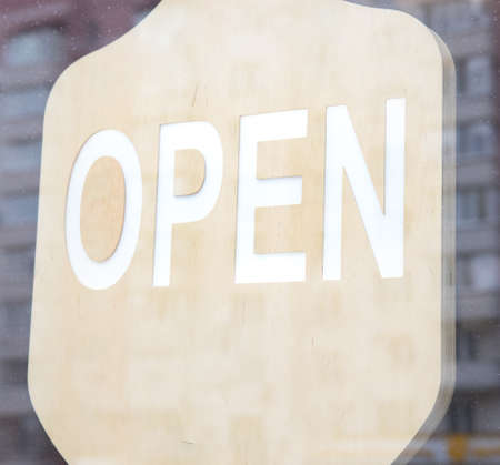 A sticker on the doors of the store with the inscription open.の写真素材