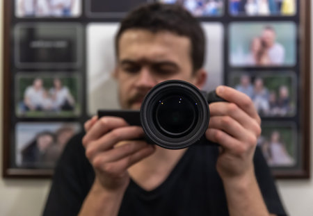 The lens is in the hands of the photographer at the moment of shooting close up.の写真素材