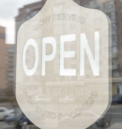 A sticker on the doors of the store with the inscription open.の写真素材