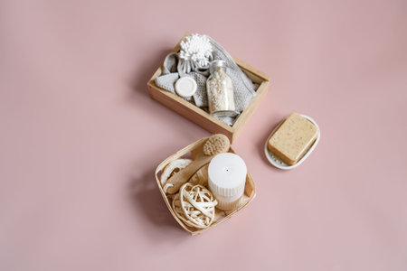 Spa composition with soap, brush, candle and various bath accessories in boxes.