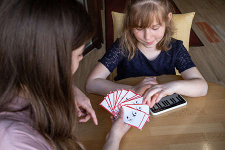 Music theory lesson, solfeggio using the piano app in your phone and educational flashcards.