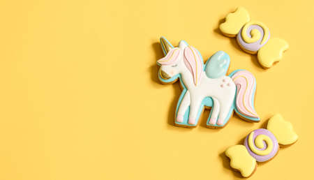 Beautiful gingerbread cookies for children's party in the shape of a unicorn and sweets, flat lay.の写真素材