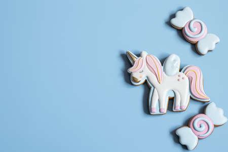 Beautiful gingerbread cookies for children's party in the shape of a unicorn and sweets, flat lay.の写真素材