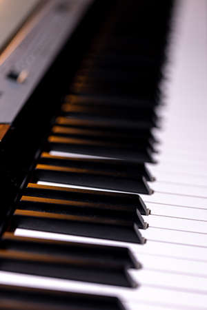 Close up of piano keyboard. Shallow depth of field.の写真素材