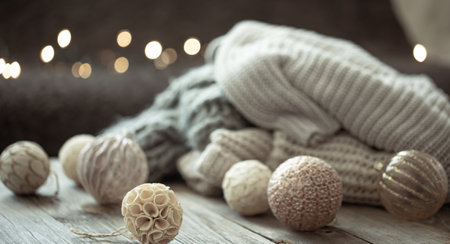 Cozy Christmas background with Christmas decorations and knitted element on a blurred background.の写真素材