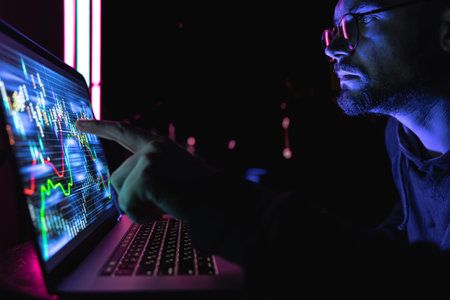 Serious business man trader analyst looking at a computer monitor, investor broker analyzing...