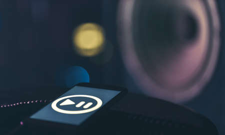 Music background with phone and with music icon and column, modern technology concept, listening to music.の写真素材