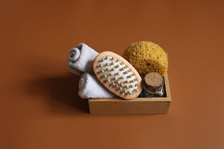 Minimalistic spa composition with massage brush, washcloth, towels for body care and personal...