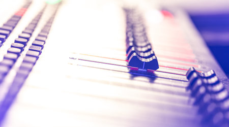 Close up, sound music mixer control panel on blurred background.