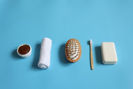 Minimalistic spa composition with soap, toothbrush, massage brush, scrub and towel, personal hygiene...
