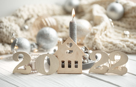 Christmas background with decorative 2022 numbers and cozy details.