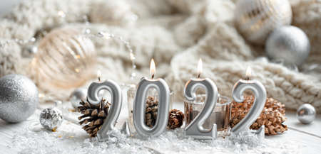 Christmas festive background with candles in the form of the numbers 2022.の写真素材