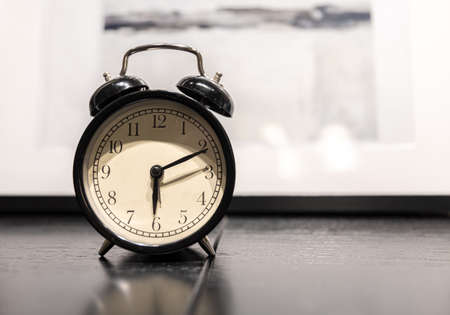 Close-up of a vintage alarm clock on a blurred background.の写真素材