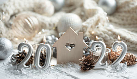 Christmas festive background with candles in the form of the numbers 2022.の写真素材