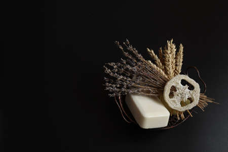 Spa composition with soap, loofah and natural herbs, copy space.の写真素材