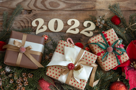 Christmas background with numbers 2022 and holiday gifts, top view.の写真素材