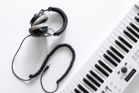 Musical flat lay background with headphones musical keys.