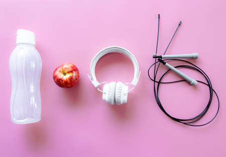 Sports equipment items on pink background, flat lay.の写真素材