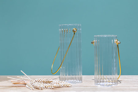 Decorative glass jars for storage on a blue background.