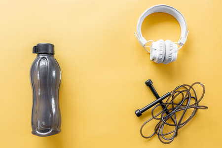 Flat lay composition with sports equipment on yellow background.の写真素材